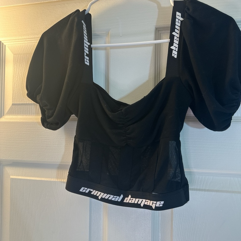 Criminal damage made in London crop top with some see-through net at the bottom